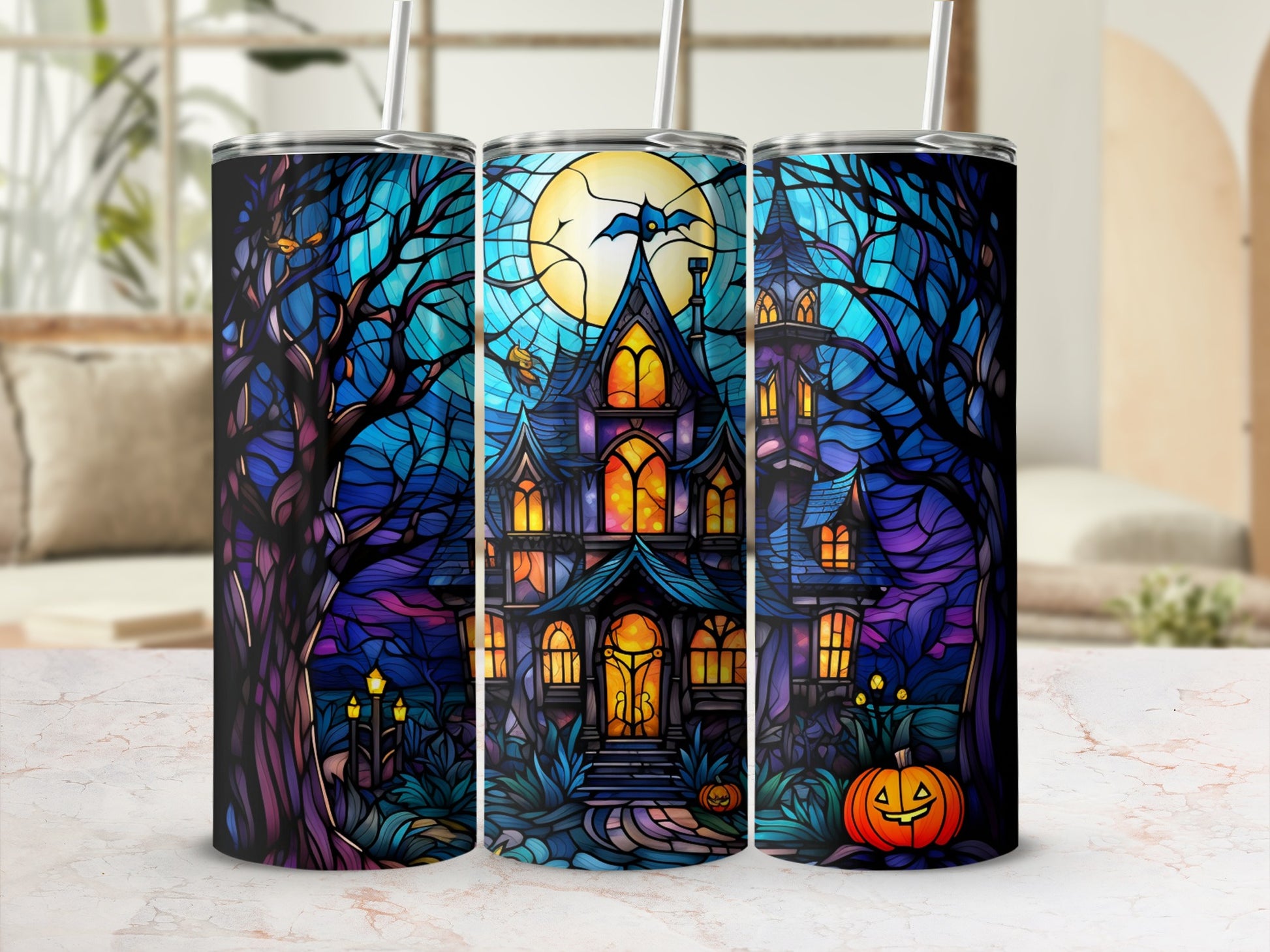 Halloween haunted house with moon and pumpkin design on a tumbler.