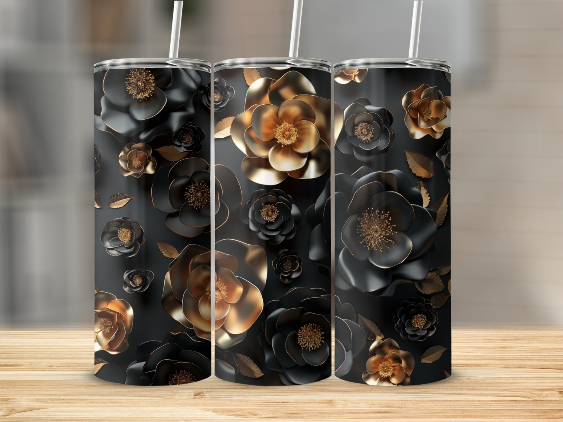 Three black tumblers with embossed gold and black floral patterns.