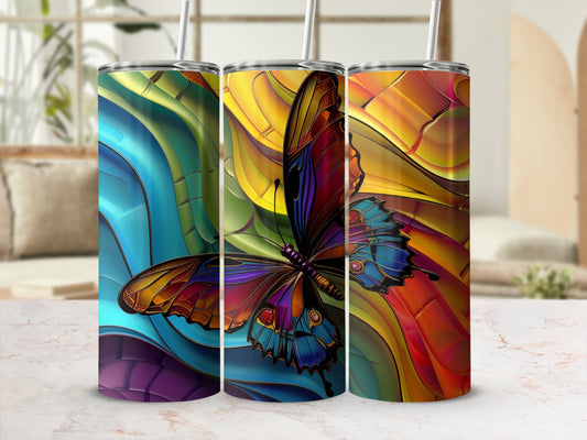 Colorful stained glass butterfly pattern on three tumblers with straws.