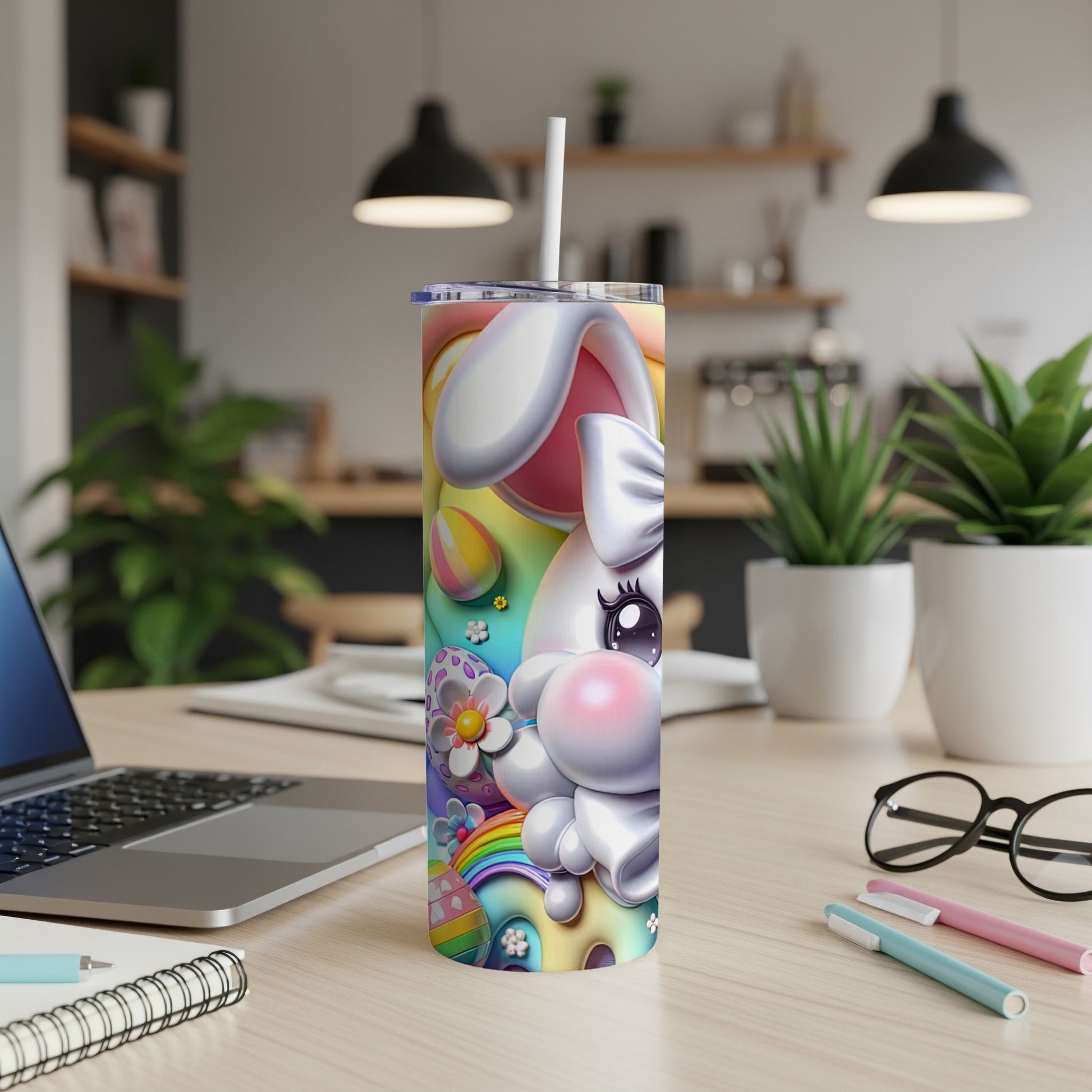 White bunny with colorful Easter-themed design on a tumbler.