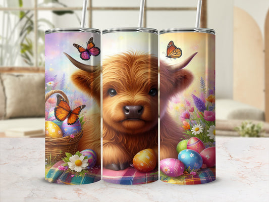 Highland cow with Easter eggs and butterflies on a tumbler.