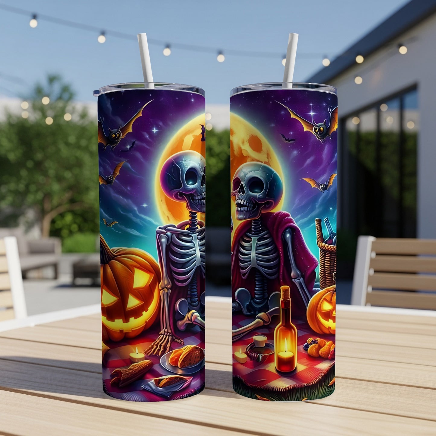 Two tumblers with Halloween skeletons, pumpkins, bats, and a full moon design.