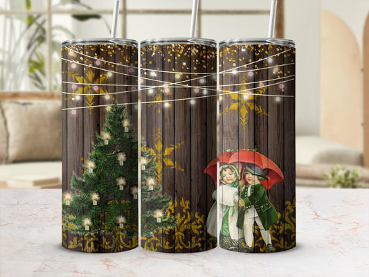 Christmas tumbler with illuminated tree, snowflakes, and couple under umbrella.