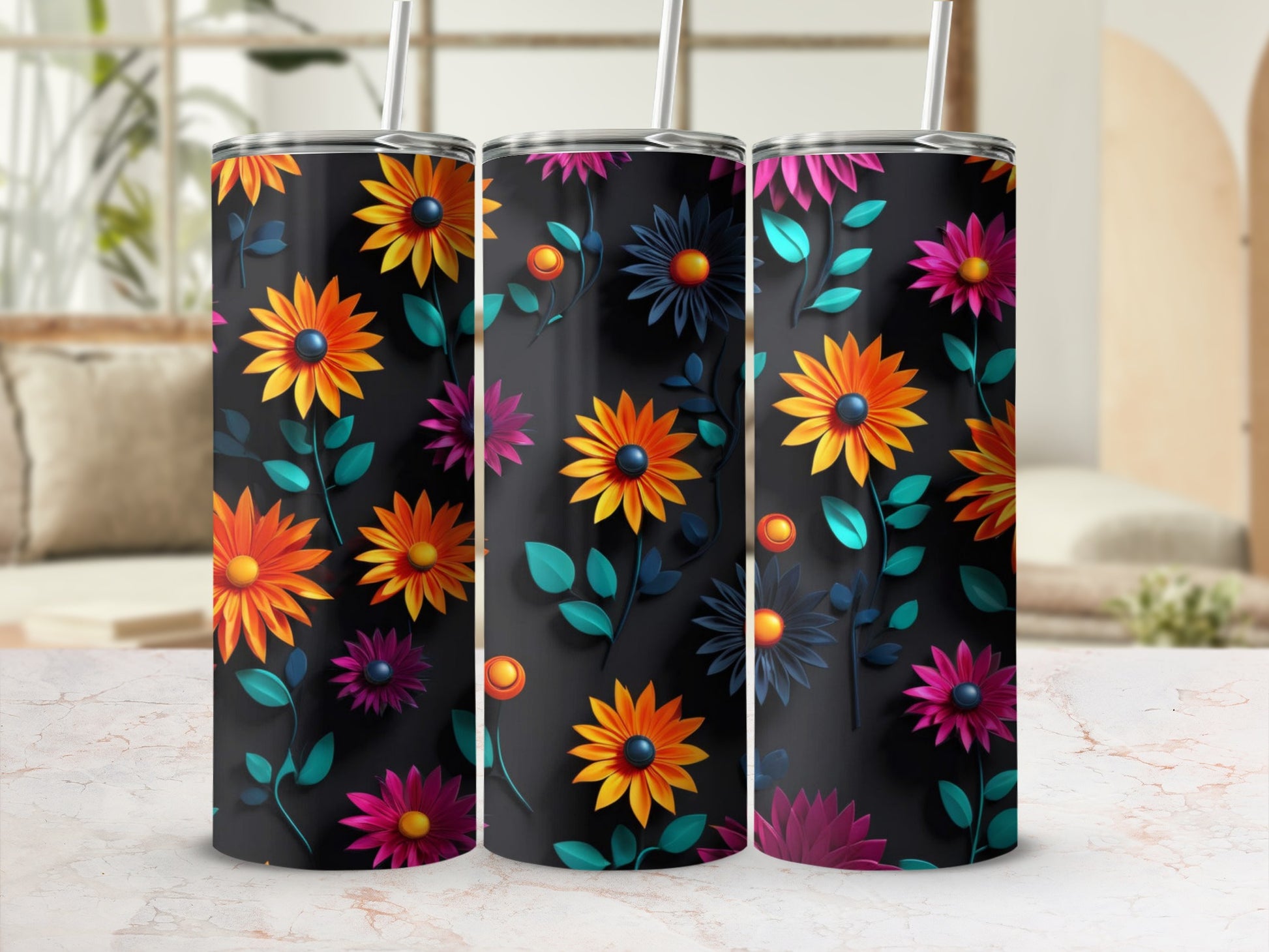 Three tumblers with colorful floral patterns on a dark background.