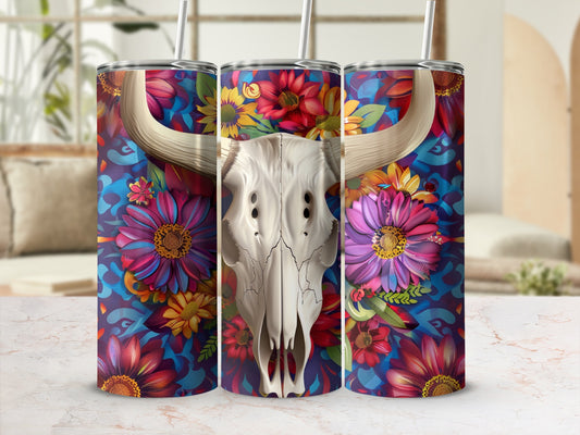 Floral bull skull tumbler with straws on a marble surface.