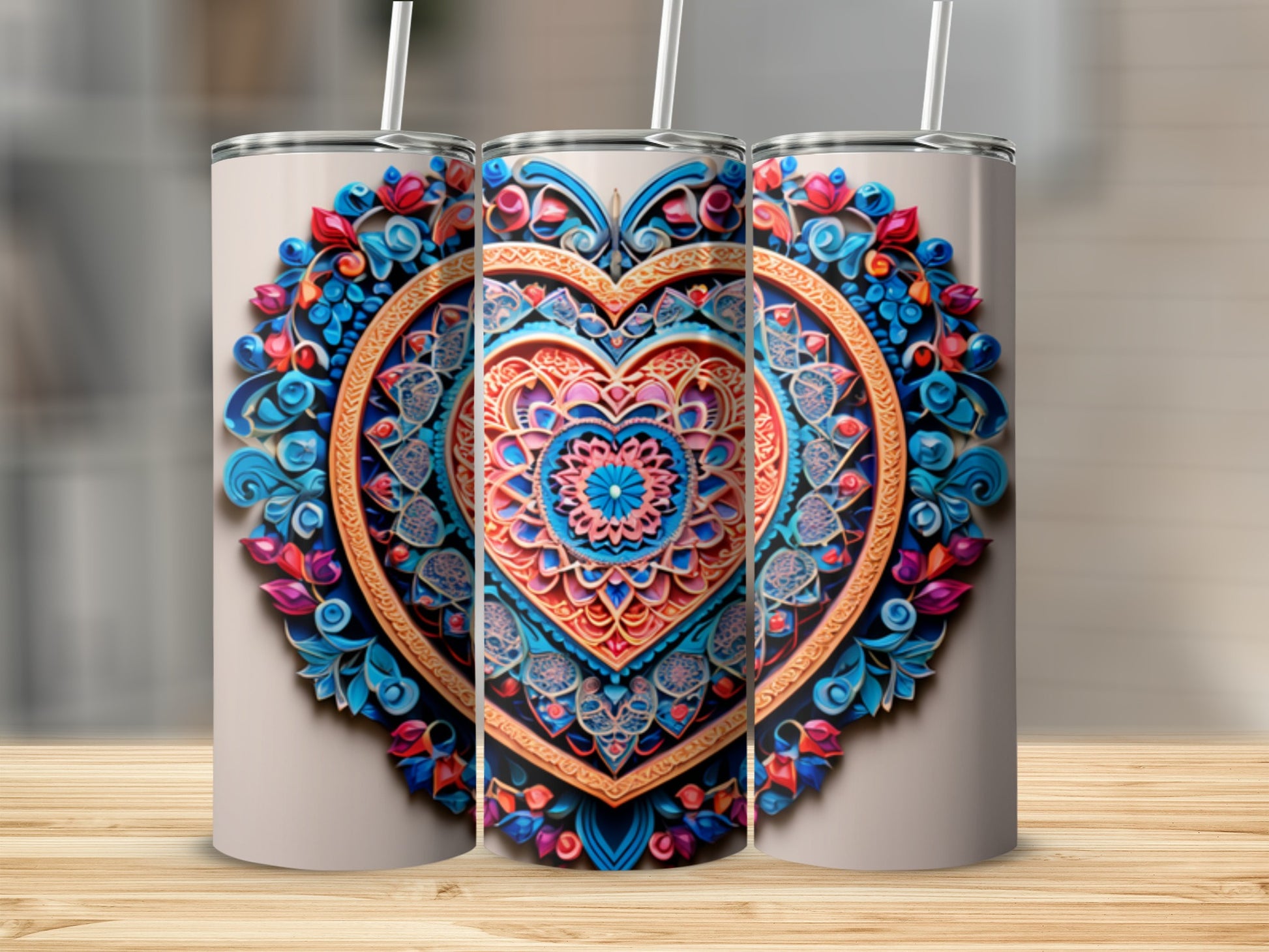 Three tumblers with ornate, colorful heart mandala designs.