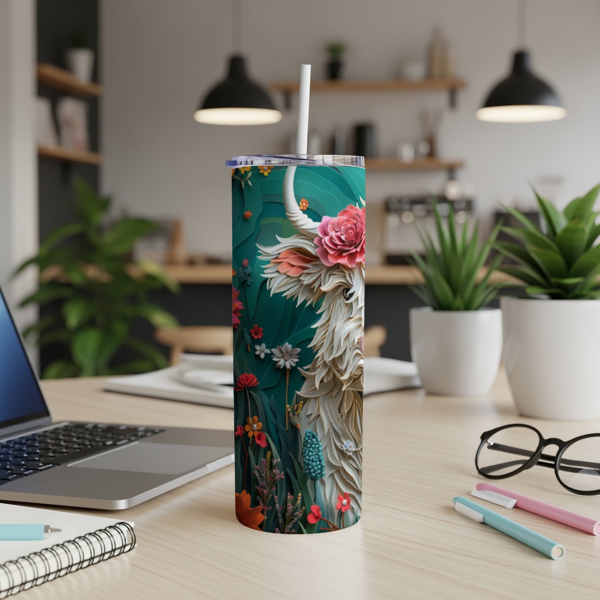 Highland cow illustration on a teal tumbler with flowers and leaves.