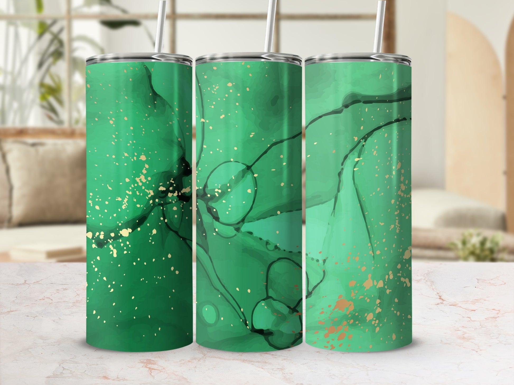 Three green abstract watercolor tumblers with gold speckles and straws.
