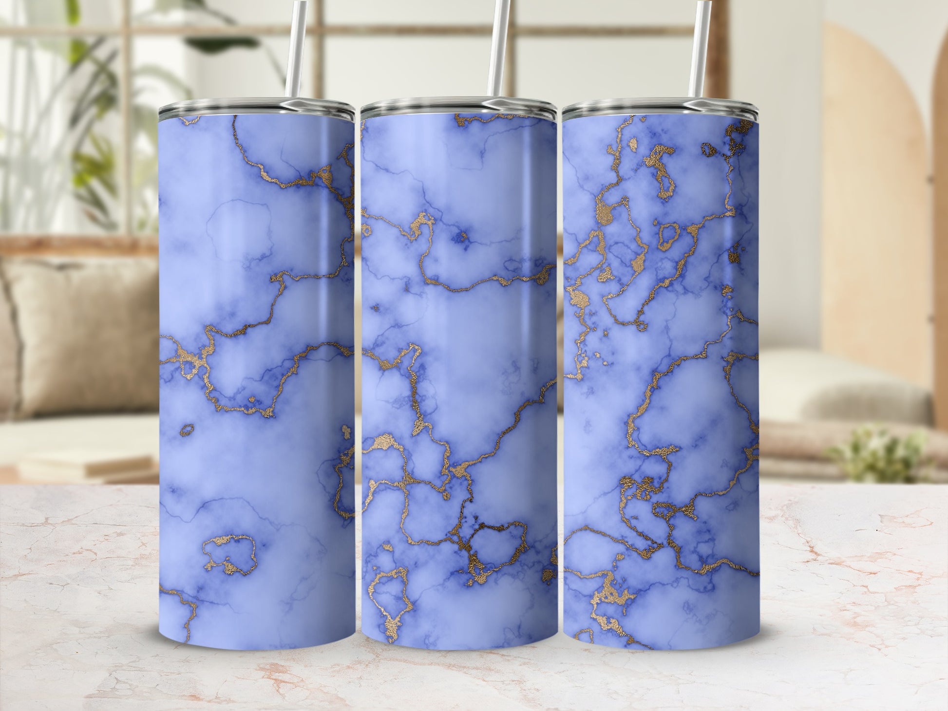 Three tumblers with a blue marble and gold veining pattern.