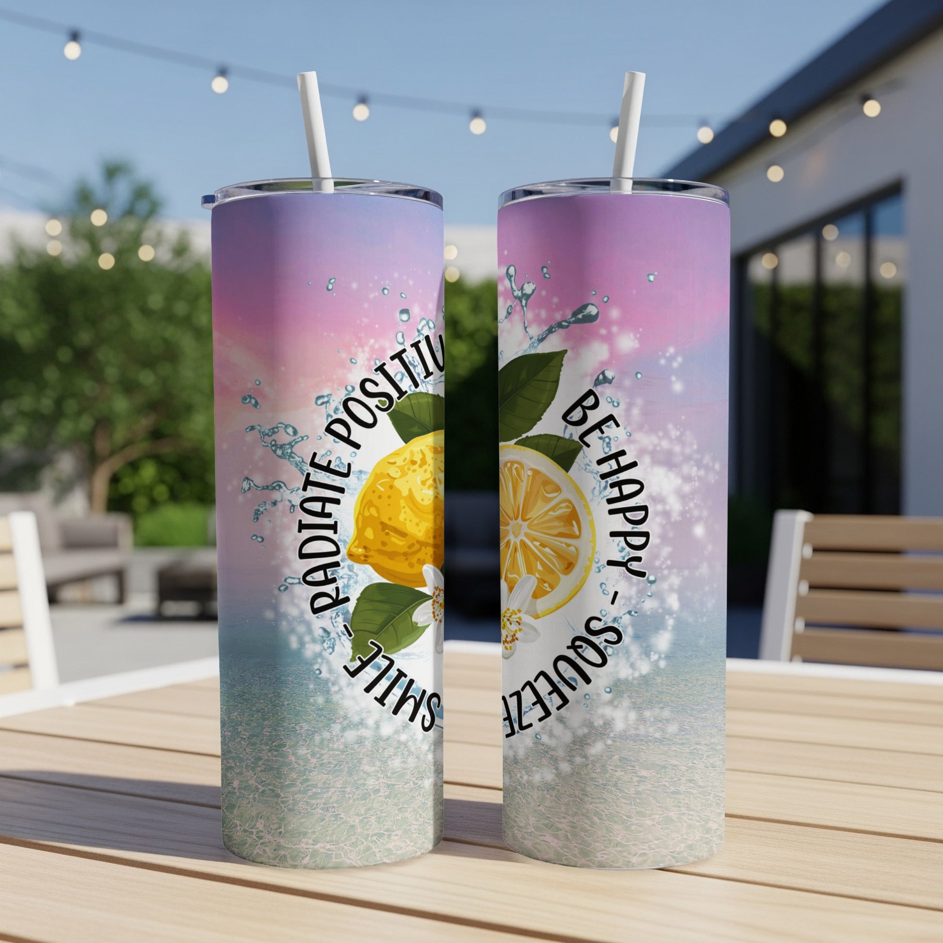 Two tumblers with "Radiate Positivity, Be Happy, Squeeze" and lemon designs.