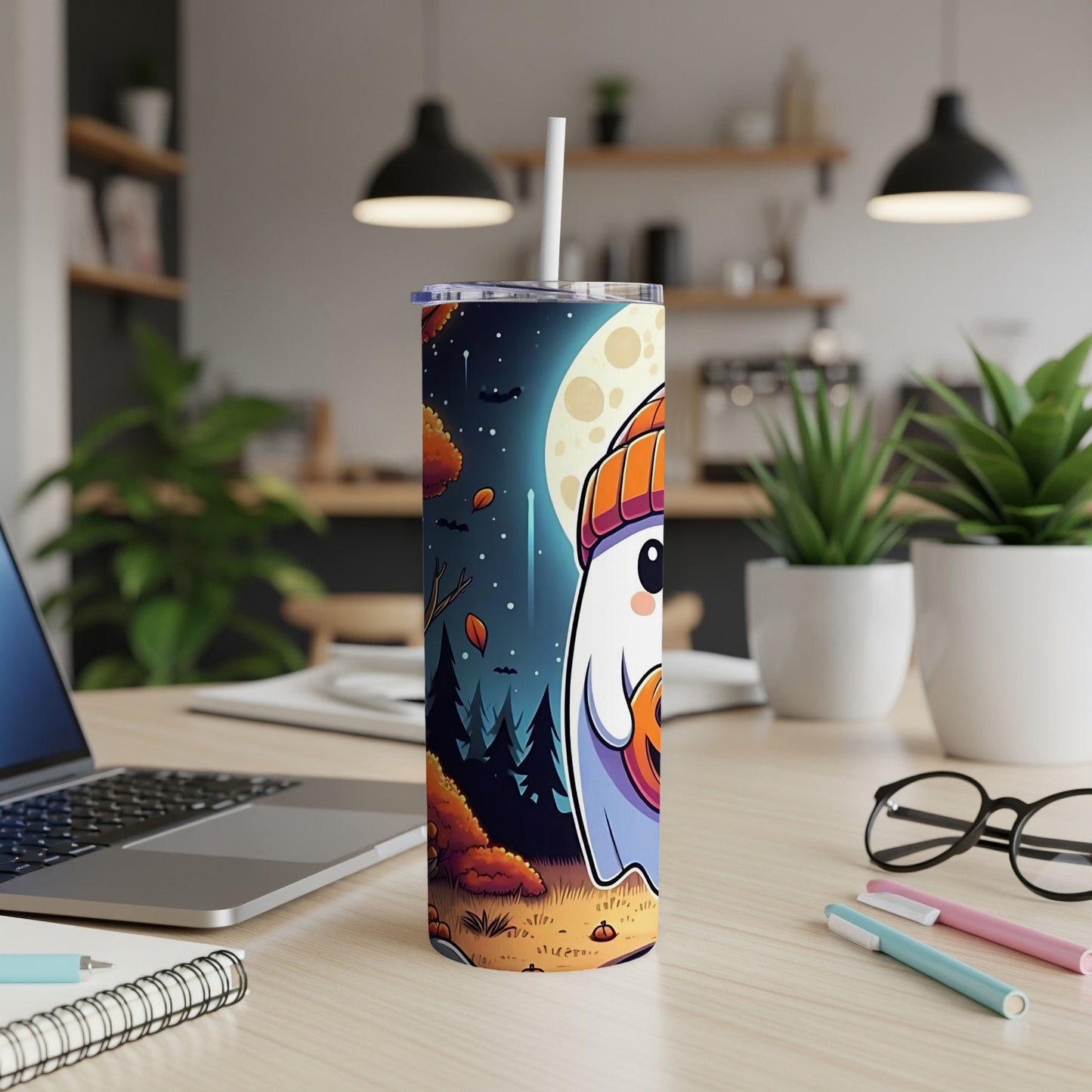 Tumbler with cartoon ghost holding pumpkin against a nighttime moonlit forest scene.