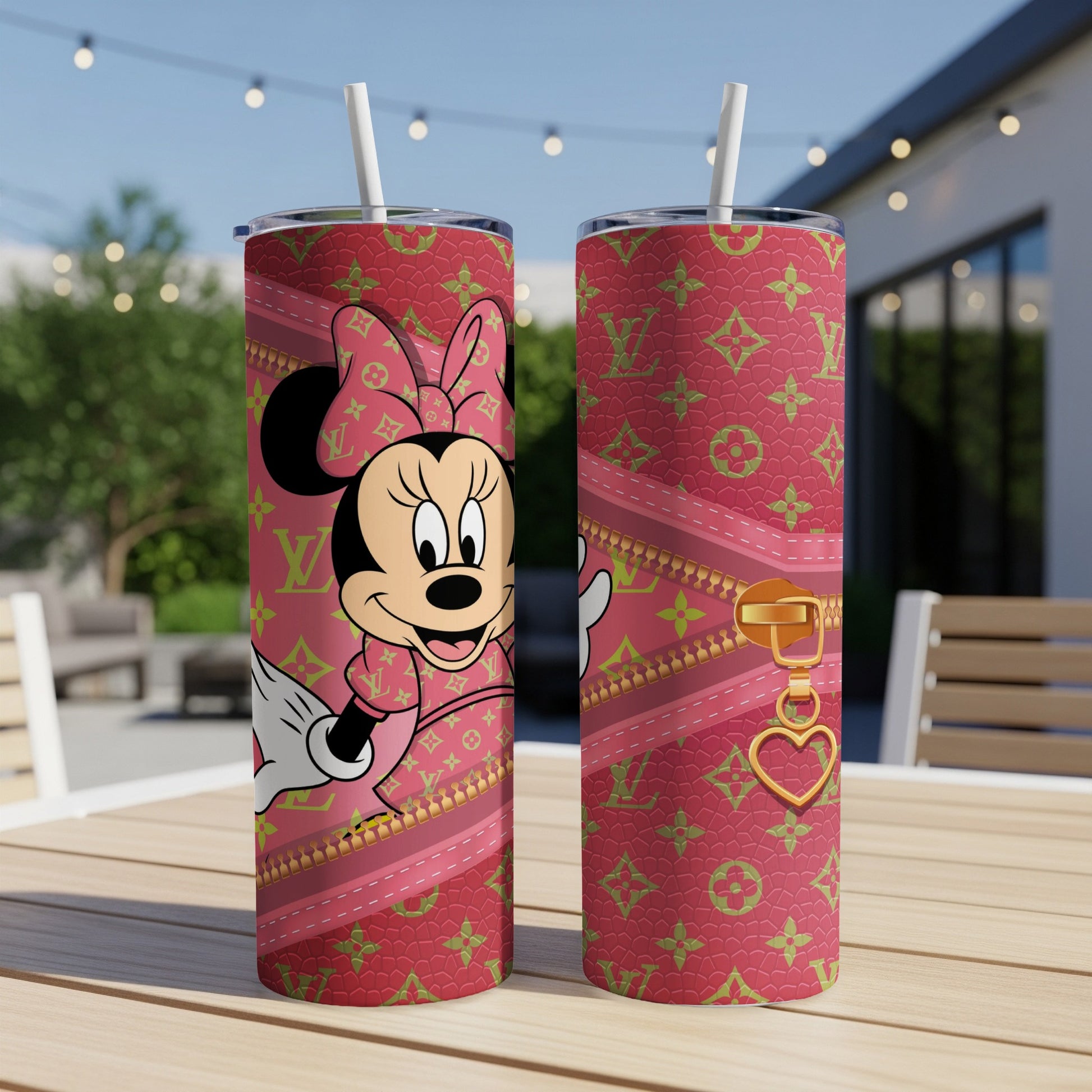 Minnie Mouse in pink patterned tumbler with gold zipper detail.