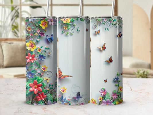 Three tumblers with a floral and butterfly design.