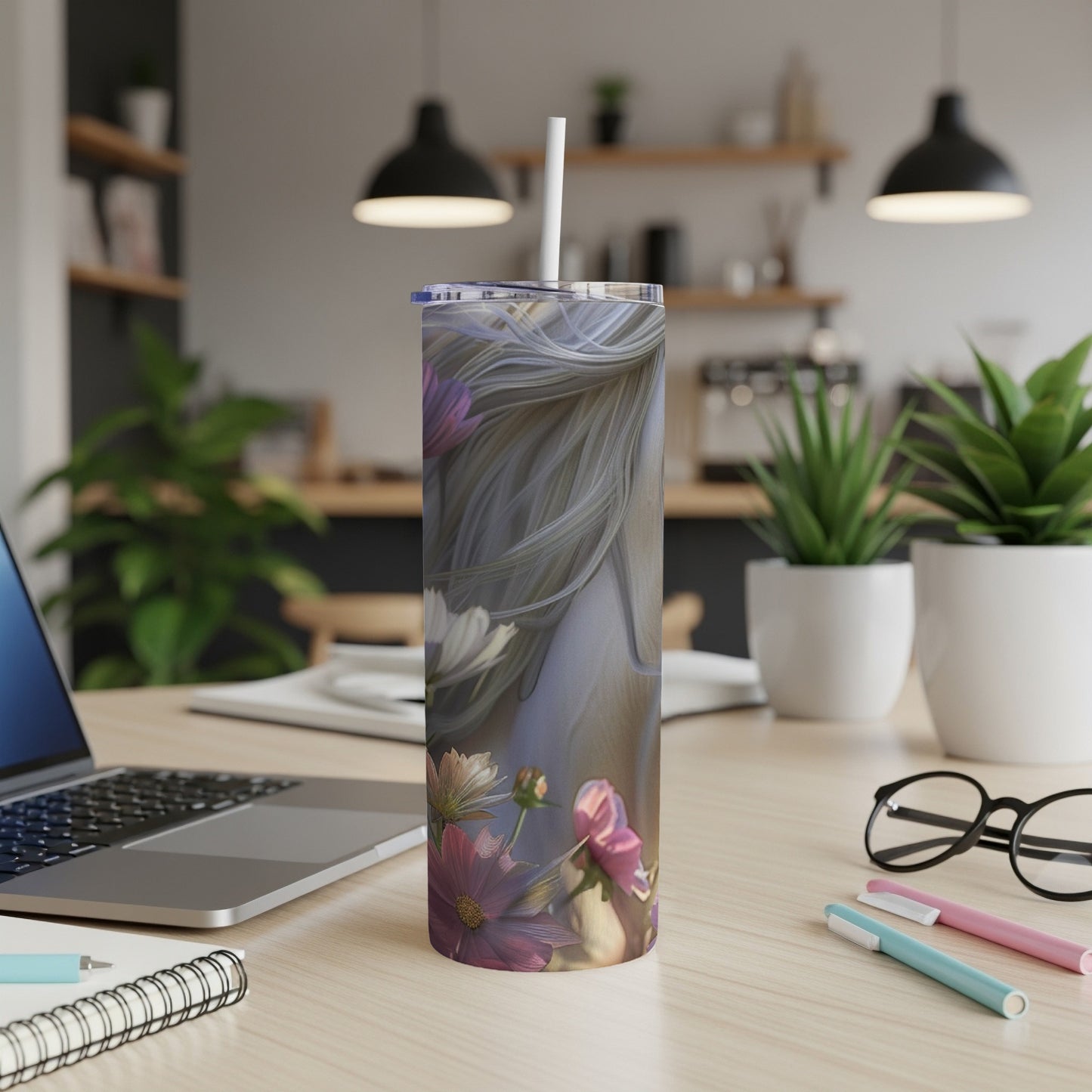 Floral tumbler with horse silhouette design, white straw, on a desk.