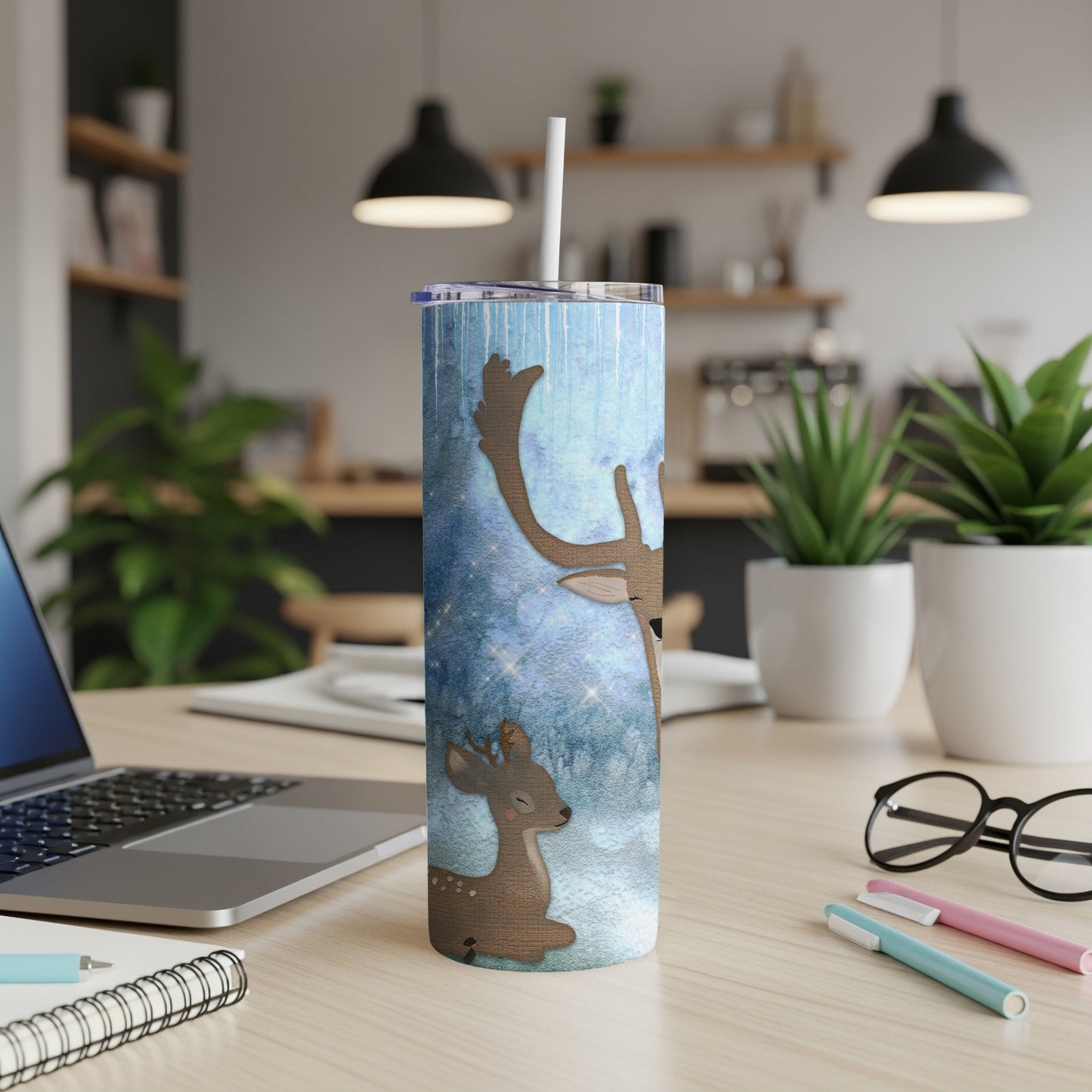 Two cartoon deer with starry background on a white tumbler.