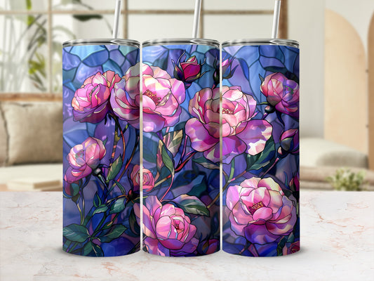 Three tumblers with a stained glass rose design on a marbled surface.