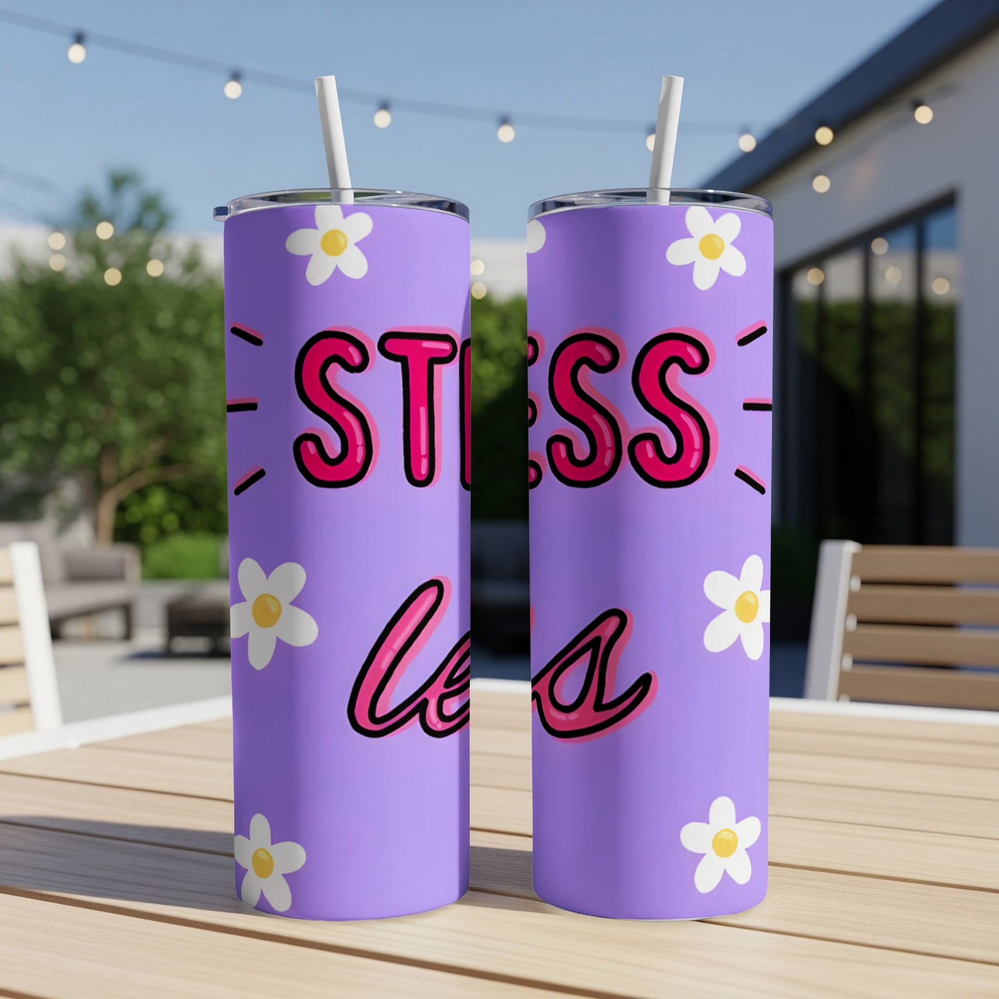 Purple skinny tumblers with "STRESS LESS" text and daisy pattern.