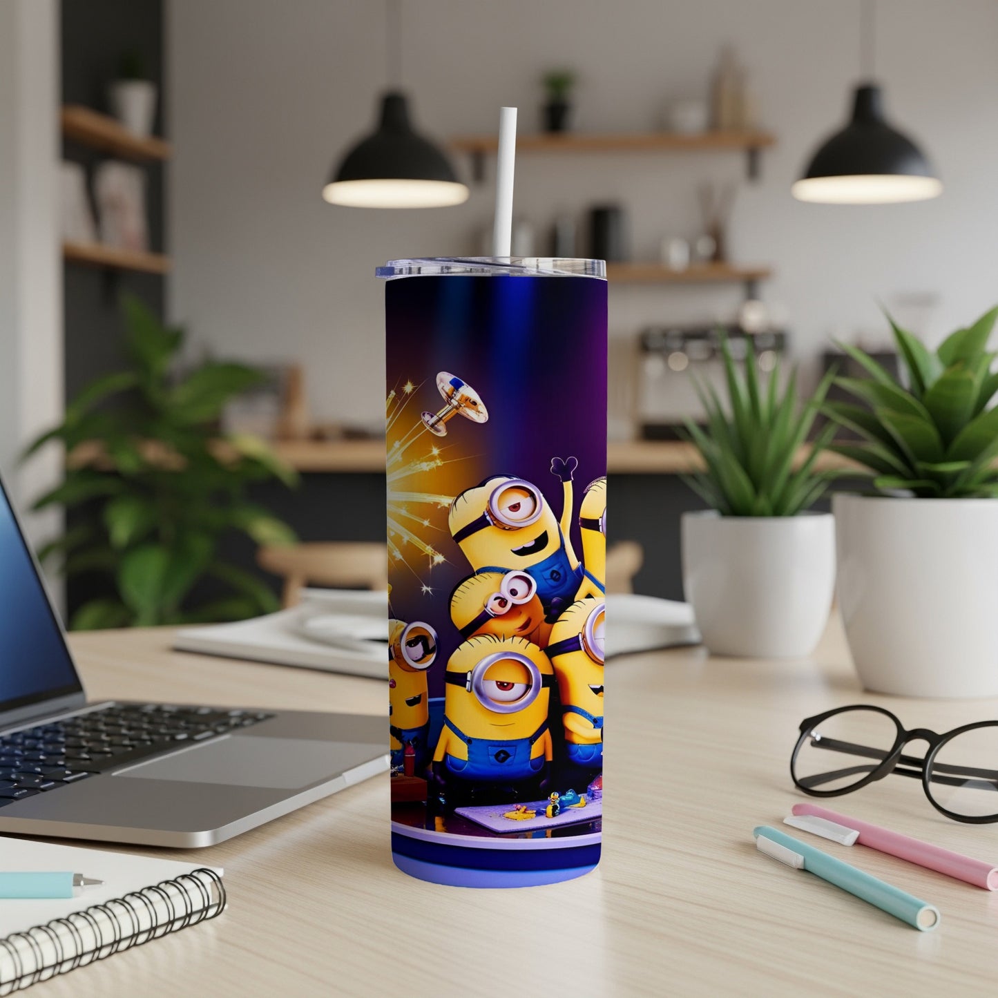 Minions characters on a purple tumbler with a straw, sitting on a table.