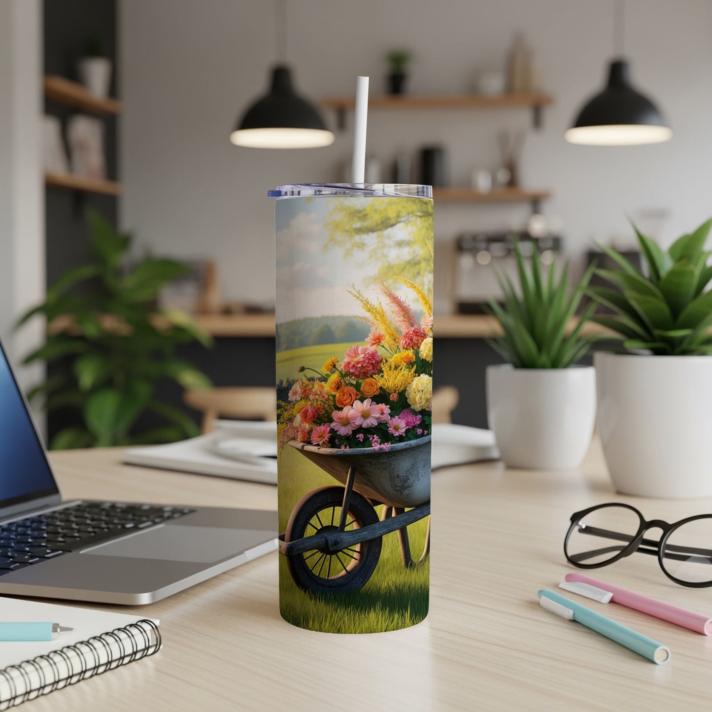 Tumbler with floral bouquet in a wheelbarrow design.