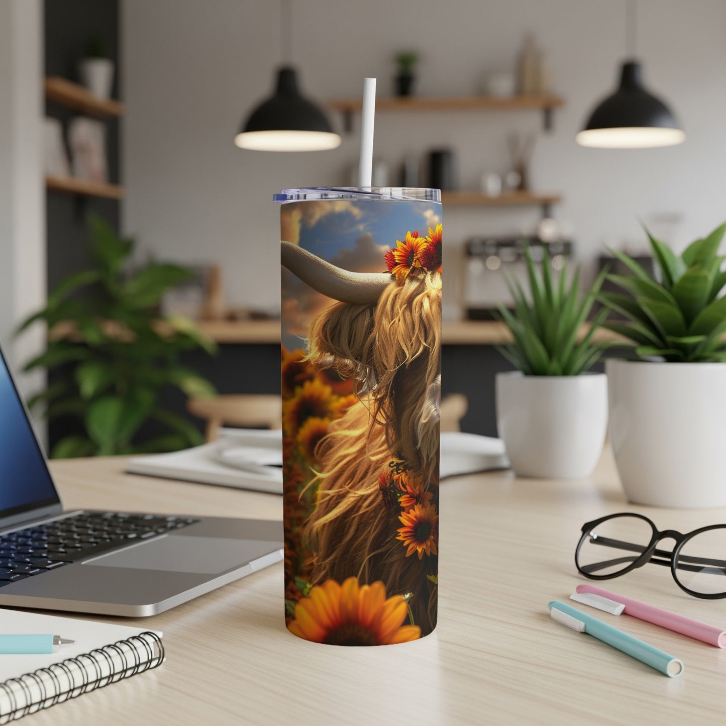 Highland cow with sunflowers on a tumbler.