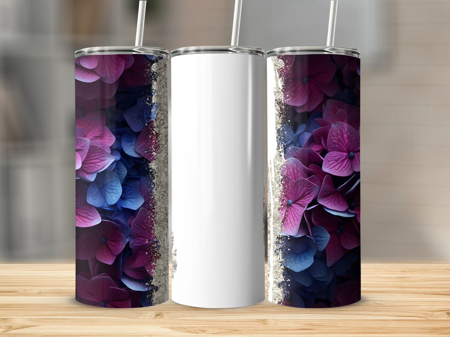 Tumbler with purple and blue floral design and glitter accents.