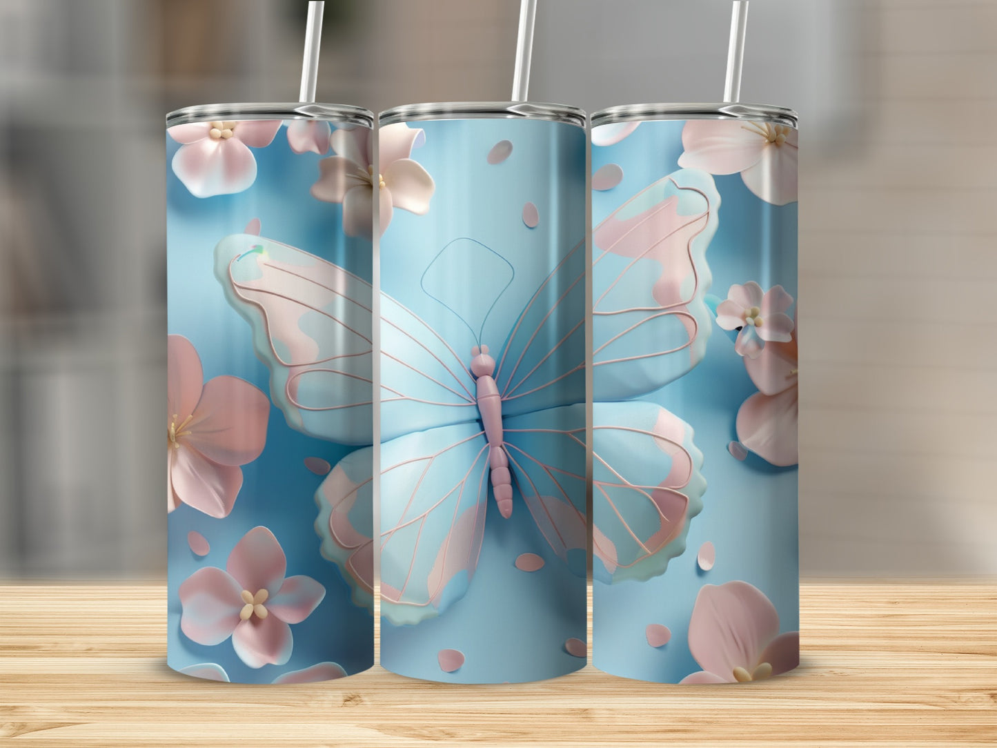 Three light blue tumblers with pink butterflies and flowers.
