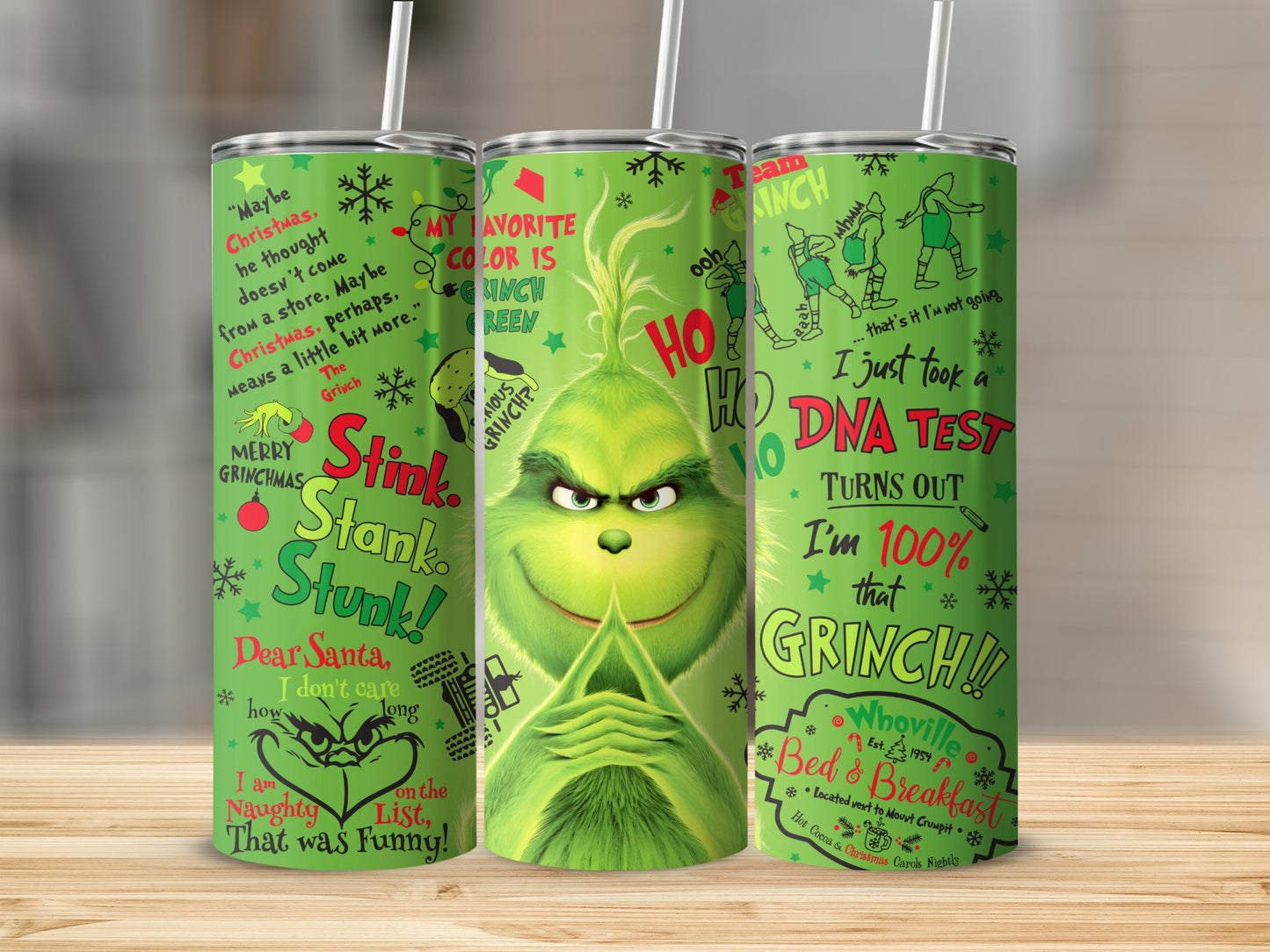 Green Grinch tumbler with Christmas quotes and graphics.
