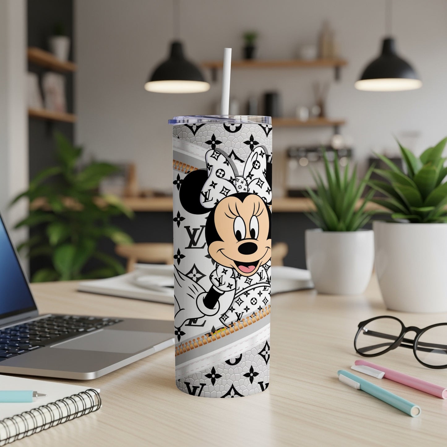 Minnie Mouse on a white tumbler with Louis Vuitton pattern and straw.