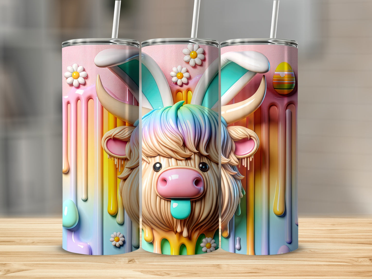 Pink tumbler with cute cow wearing bunny ears and colorful drips.