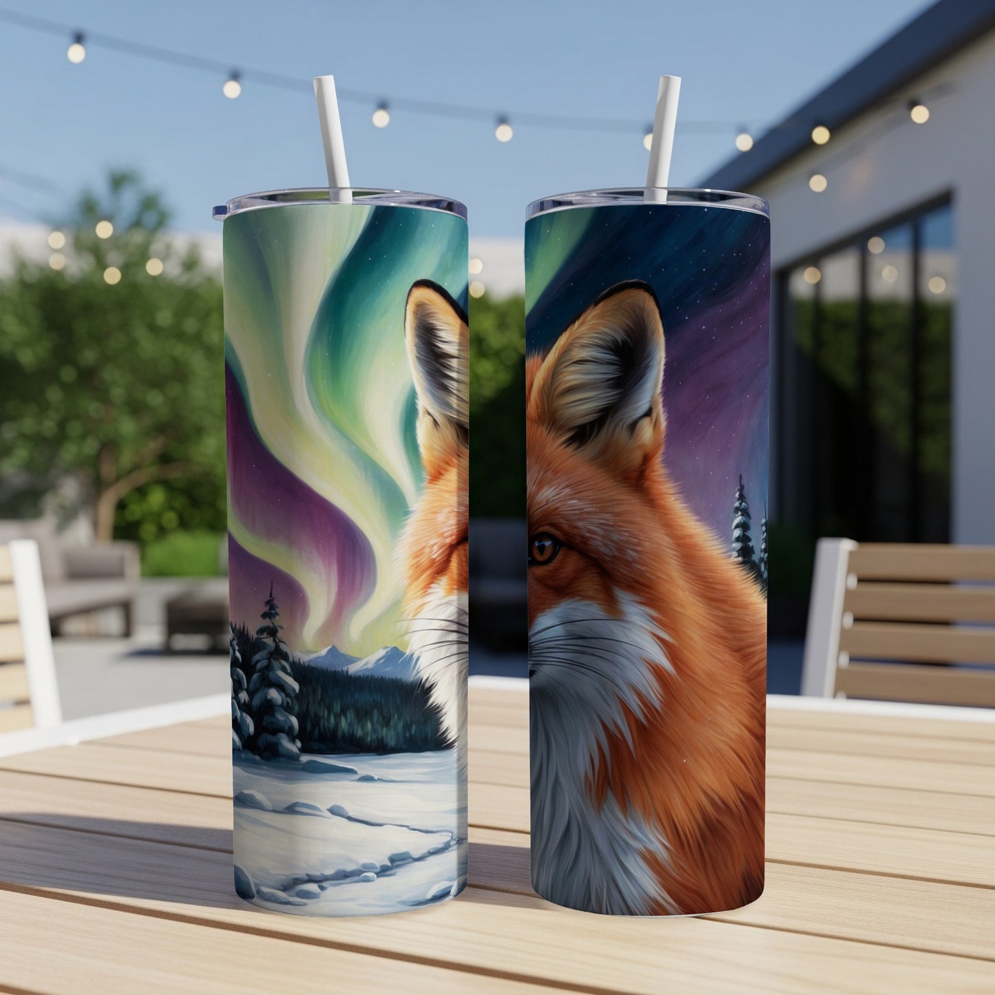 Two tumblers featuring a fox and aurora borealis against a snowy forest backdrop.