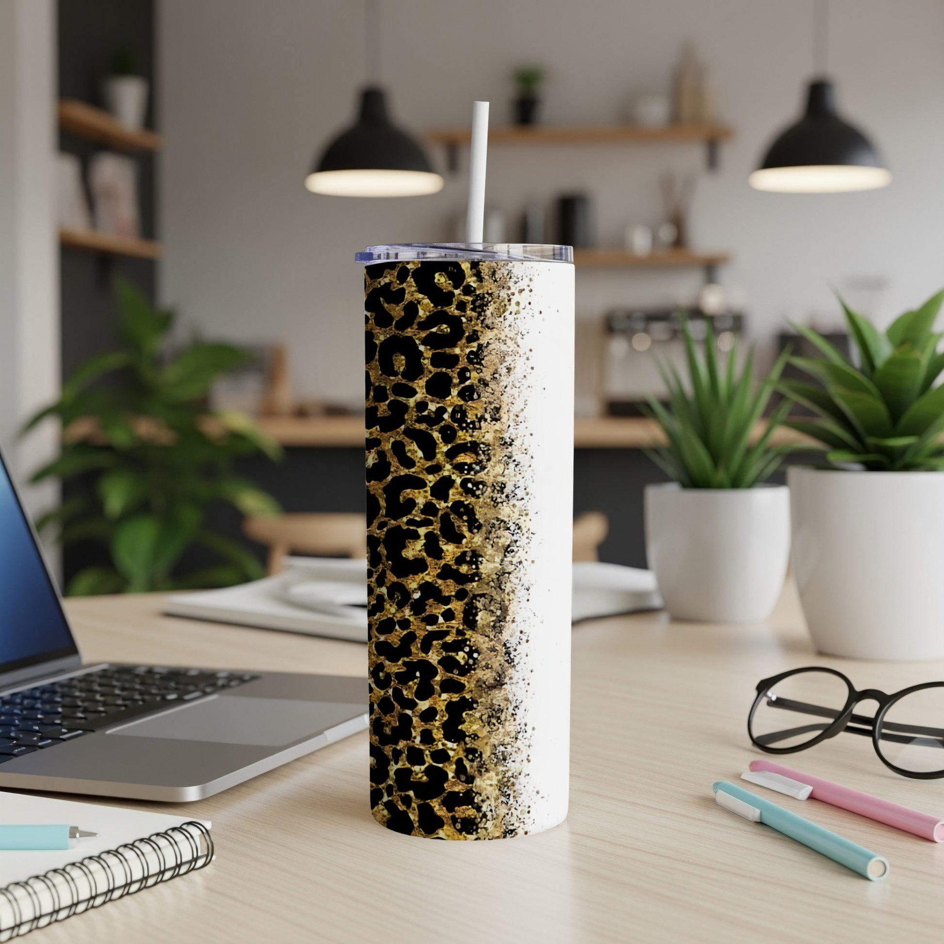 White tumbler with black and gold leopard print fading to white.