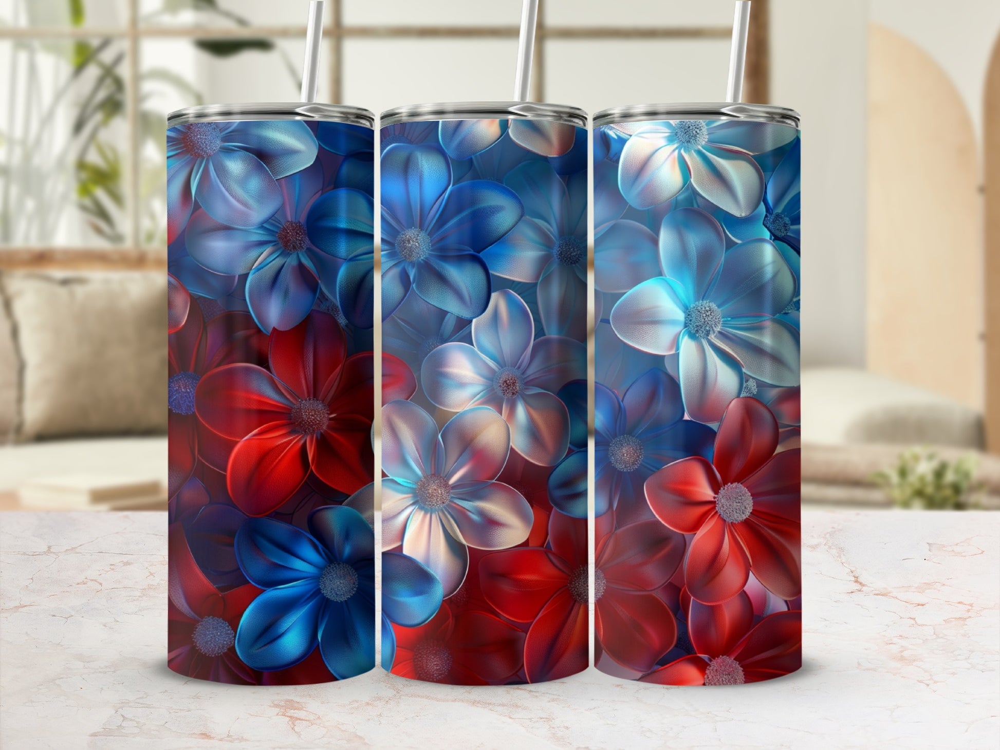 Three tumblers featuring red and blue floral patterns with straws.