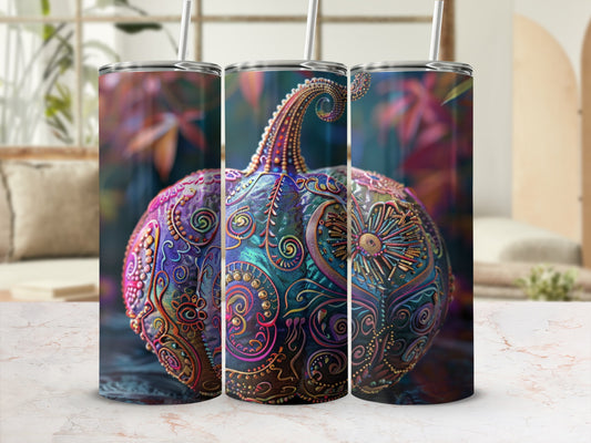 Decorative pumpkin tumbler with intricate swirling patterns and metallic accents.
