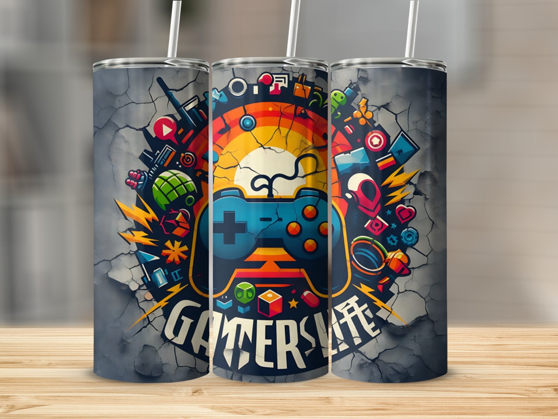 Gaming-themed tumbler with controller and colorful game icons against a cracked background.