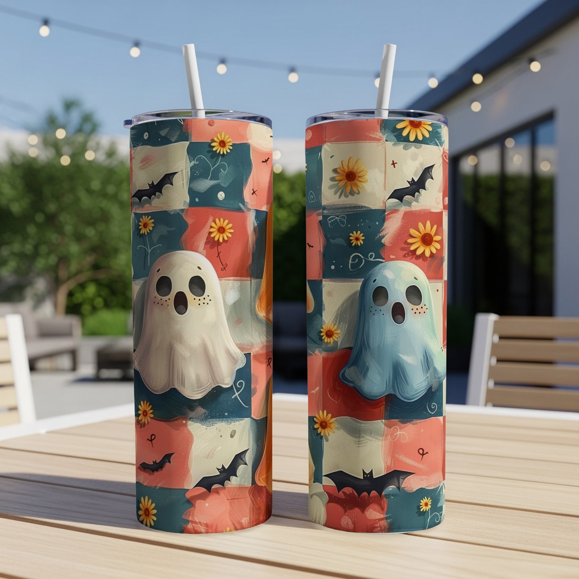 Two tumblers with a Halloween patchwork design featuring ghosts and bats.